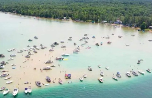 Rapid City Cabaña | Rapid River Retreat riverfront close to Torch Lake