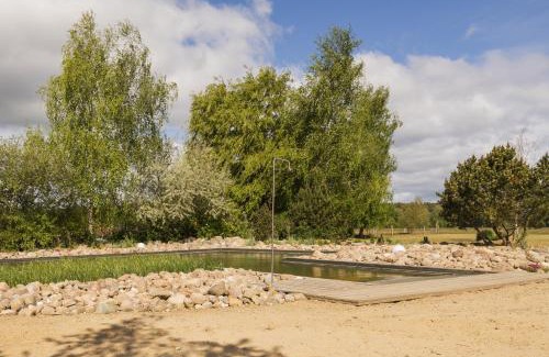 Krienke Casa | Reetdachhaus Kranich mit Schwimmteich in Krienke