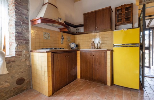 Castiglione della Pescaia Apartamento | Reggia, in small medieval village characteristic apartment with fireplace