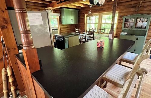 Harwich Casa | Relax in a tranquil log home on direct lake front property. The Hermitage awaits