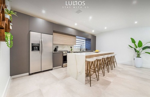 Richmond West Casa | Relax in Style: Pool, Golf, Luxe Kitchen, Sleeps 12