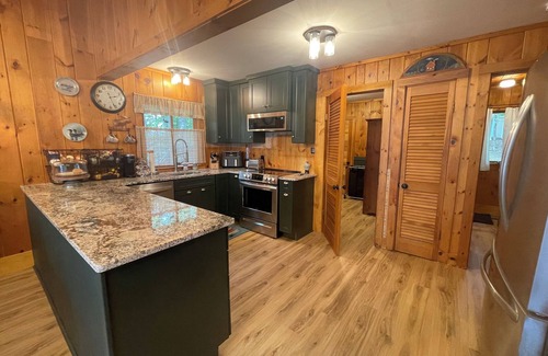 Oxford Cabaña | Relax in the glow of a campfire at this waterfront cottage on Thompson Lake