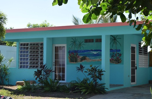 Hatillo Casa | Relajada casa frente al mar en una tranquila playa bordeada de palmeras con un gran patio frente al mar