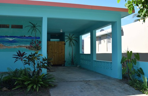 Hatillo Casa | Relajada casa frente al mar en una tranquila playa bordeada de palmeras con un gran patio frente al mar