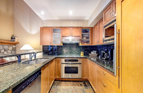 Village North Casa | Relaxing first-floor townhouse with a private hot tub, fireplace, & great views