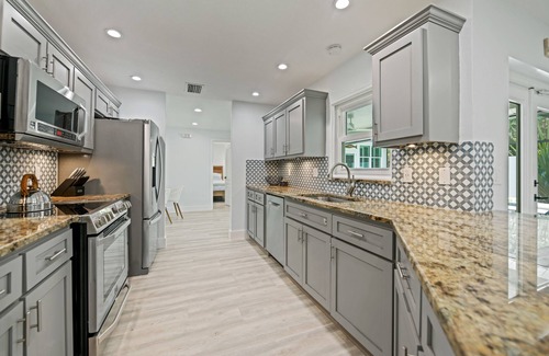 Bay Isle Casa | REMODELED, Heated Pool and Spa, POOL Table, games, bikes included!