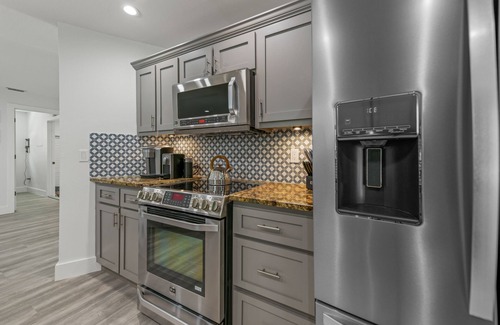 Bay Isle Casa | REMODELED, Heated Pool and Spa, POOL Table, games, bikes included!