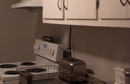 Holly Springs Cabaña | Remodeled historical loft walking distance from the Square.