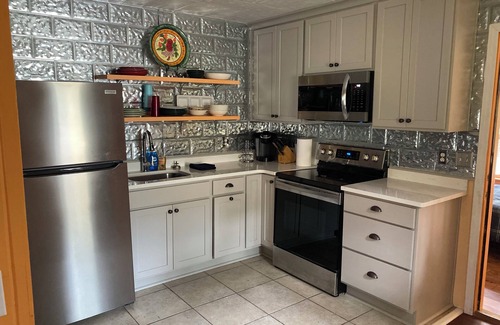 Carrabelle Cabaña | Remodeled historic cottage with a peek of the Gulf of Mexico.