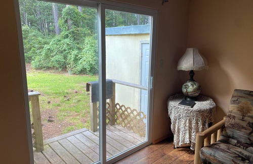 Carrabelle Cabaña | Remodeled historic cottage with a peek of the Gulf of Mexico.