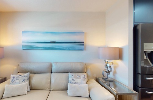 Sunset Beach Condominio | Renovated Sunset Beach Waterfront Condo with Water Views, Pool, Fishing Dock & Beach Access.