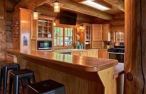 Newaygo Cabina | Relax at River's Edge: Stunning Views, Hot Tub, Pet-Friendly!