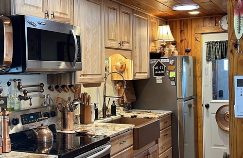 Indian River Cabaña | Riverfront Cottage w/ Boat Docking and easy access to Burt Lake