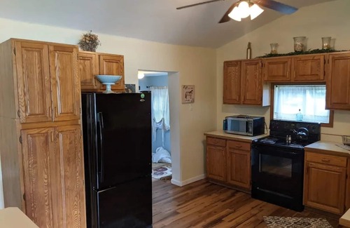 Colton Cabaña | Riverfront Cottage with Hot Tub, Kayaks, Canoes, & Fishing Boats!