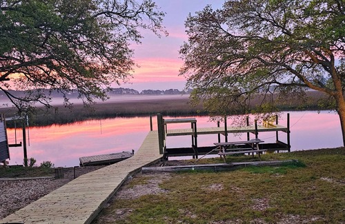 Carrabelle Casa | Riverfront Retreat- Fishing Dock, Screen Porch, Shaded Lawn, Adirondack Chairs