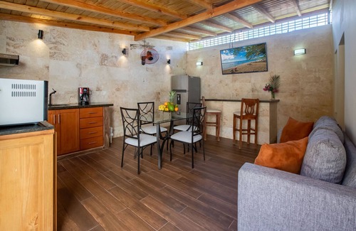 El Batey Casa | Room in Guest Room - Central Area Bedroom With Common Kitchen, Living Room