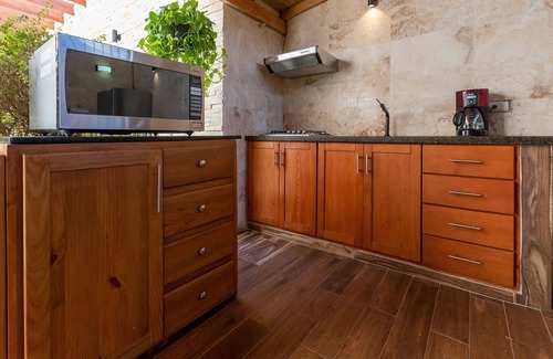 El Batey Casa | Room in Guest Room - Central Area Bedroom With Common Kitchen, Living Room