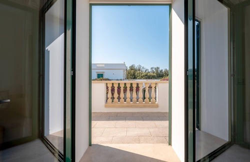 Castromediano Apartamento | Habitación 'San Biagio - Superior 104' con piscina compartida, Wi-Fi y aire acondicionado.