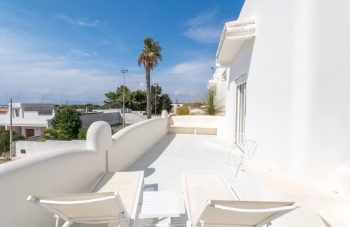 Porto Cesareo Apartamento | Habitación 'Valentino Luxury - 01' con vista al mar, Wi-Fi y aire acondicionado