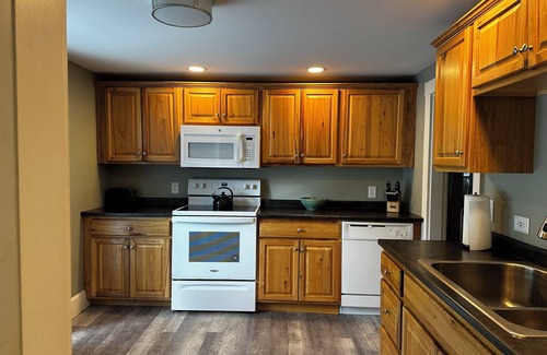 Sebago Casa | Roomy 3 bedroom with fireplace & wood-burning stove steps away from Sebago Lake