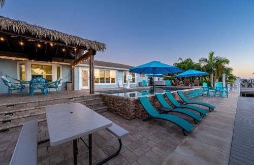 Whitney Beach Casa | Royal Palm Paradise! Waterfront, Private Pool & Hot Tub, Boat Dock!