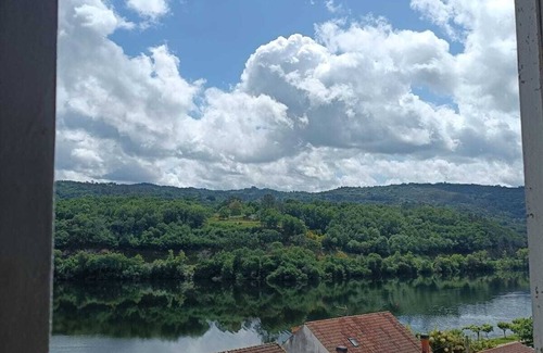 Coles Apartamento | Rustic apartment with stunning views of Rio Mino and surrounding mountains.