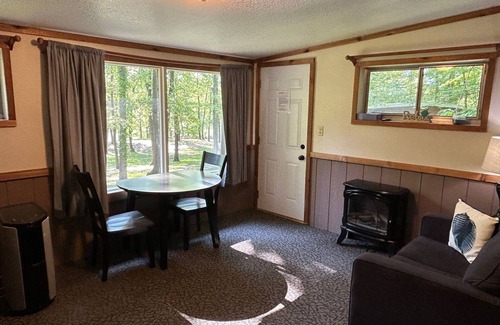 Palmyra Cabina | Rustic cabins in secluded campground with lake access and woods to wander in.