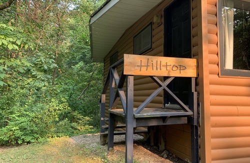 Palmyra Cabina | Rustic cabins in secluded campground with lake access and woods to wander in.