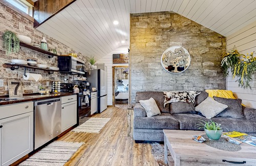 Evergreen Casa | Rustic getaway with fireplace, patio area, board games, full kitchen, & TV