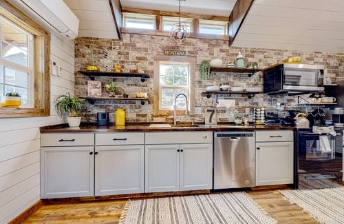 Evergreen Casa | Rustic getaway with fireplace, patio area, board games, full kitchen, & TV