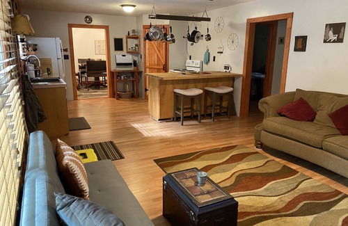 Prudenville Casa | Rustic home on wooded lot, very private. Lake and dock access. Close to trails.