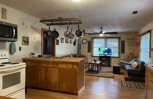Prudenville Casa | Rustic home on wooded lot, very private. Lake and dock access. Close to trails.