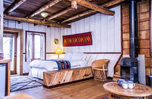 San Cristobal Casa | Rustic Log Cabin on Eco-Friendly Farm near Taos, New Mexico