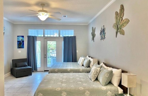 Gulf Breeze Casa | Salty Pelican Retreat on Canal with Pool, Elevator and Boat Dock