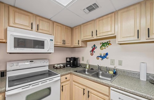 Villa Sabine Condominio | Sand Dollar E111 – Bayfront Bliss in the Heart of Pensacola Beach