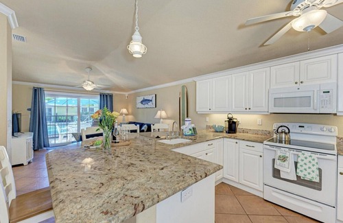 Holmes Beach Casa | Sand Dollar: Poolside Condo 2 Blocks to Beach by Anna Maria Life Vacation Rentals