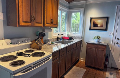 Mayfield Cabaña | Sandy waterfront near Traverse City on High Lake Dock, kayak, firepit! Dog ok