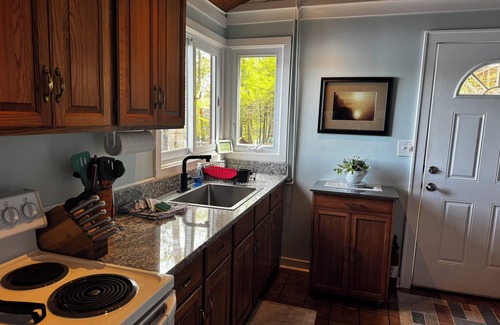 Mayfield Cabaña | Sandy waterfront near Traverse City on High Lake Dock, kayak, firepit! Dog ok