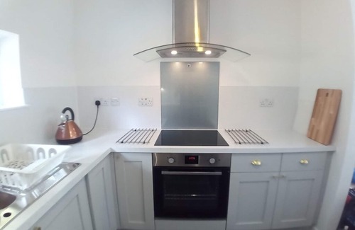 Grantown-on-Spey Cabaña | Sawmill Cottage, set in Woodland Beside the River Spey