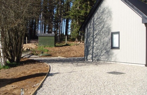 Grantown-on-Spey Cabaña | Sawmill Cottage, set in Woodland Beside the River Spey