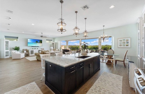 Bonita Springs Casa | Seafoam Serenity - Bayfront Retreat w/Dock, Pool & 1 Min Walk to Bonita Beach