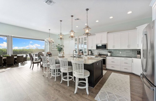 Bonita Springs Casa | Seafoam Serenity - Bayfront Retreat w/Dock, Pool & 1 Min Walk to Bonita Beach