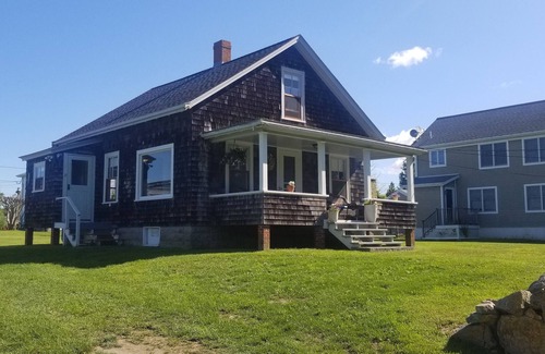Little Compton Casa | Seaside Cottage Sakonnet Point. Beautiful views of the harbor and sunsets!