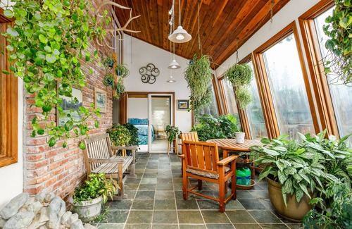 Rabbit Creek Casa | Secluded retreat with lush sunroom, scenic deck, fireplace & W/D