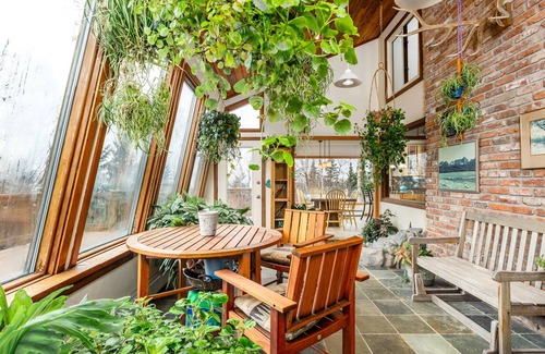 Rabbit Creek Casa | Secluded retreat with lush sunroom, scenic deck, fireplace & W/D