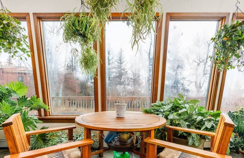 Rabbit Creek Casa | Secluded retreat with lush sunroom, scenic deck, fireplace & W/D