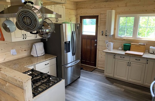 Prince County Cabaña | Semi-private beach, huge screened in deck, woods on fenced in property.