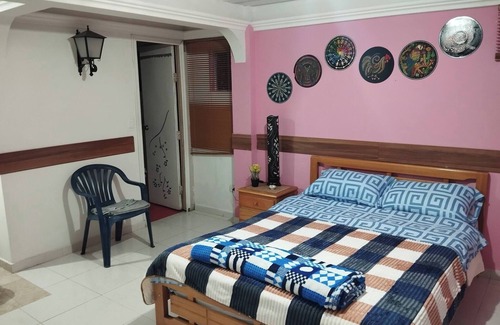 San Juan de Pasto Casa | Oasis sereno en Pasto Acogedora habitación con baño privado