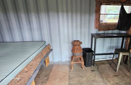 Mohawk Cabina | Shipping contain conversion into cozy copper Country cabin!!