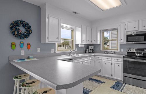 Holden Beach Casa | "Sierra Hotel" - is a 3 Bedroom, 2 bath SF House, Located on Canal with Floating Dock, Pet Friendly